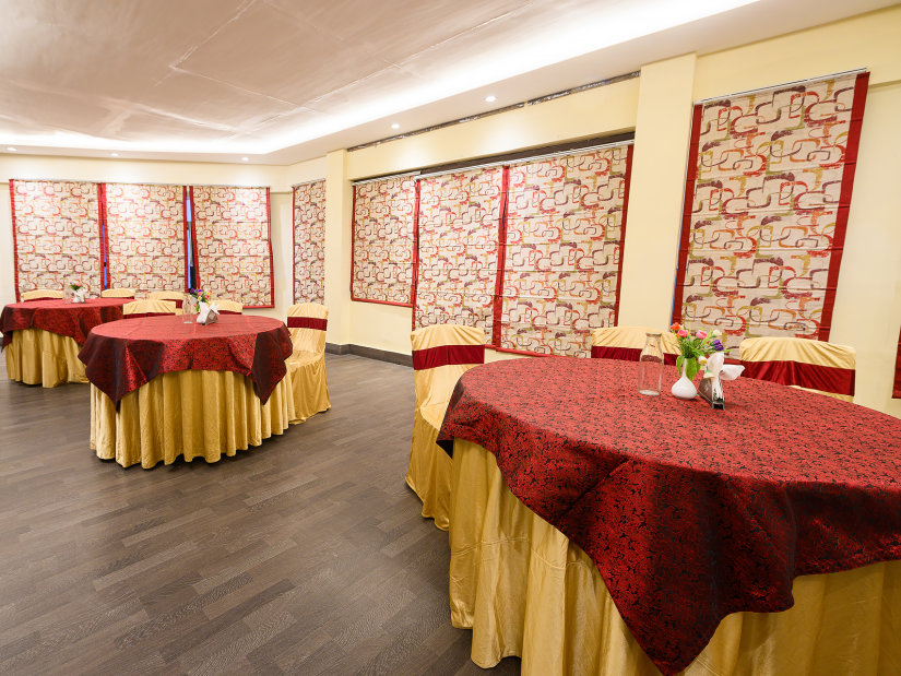 Conference room with round table seating arrangements at Silver Sand Sentinel, Port Blair