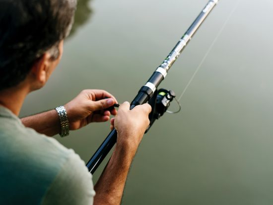 Man holding a fishing rod