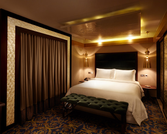 alt-text Magnificent interior view featuring mellow lighting and modern decor of hablis suite at our hotel in chennai