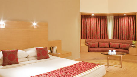 a double bed inside the Suite at VITS Luxury Business Hotel Aurangabad