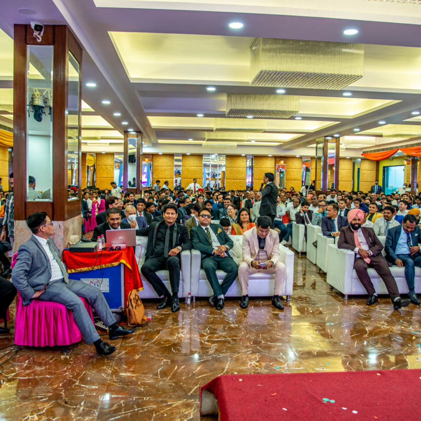 A front view of a conference hall with multiple chairs occupied by poeple Sun Park Hotel & Banquet, Chandigarh - Zirakpur