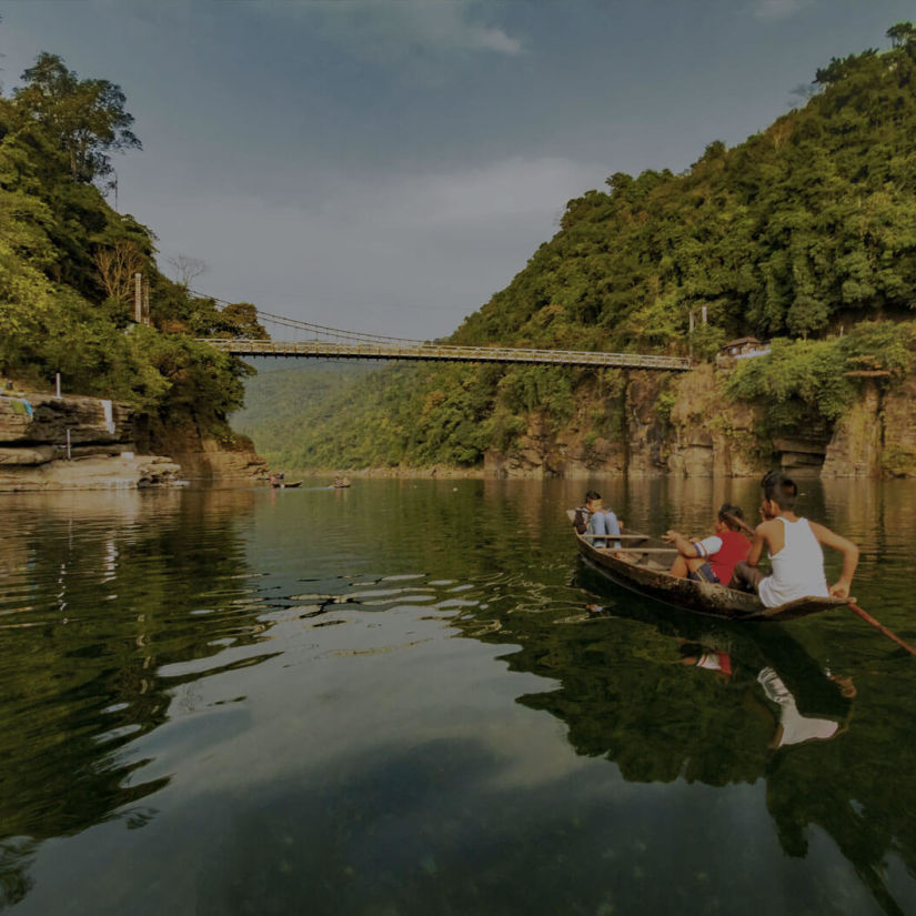 a person boating across a river