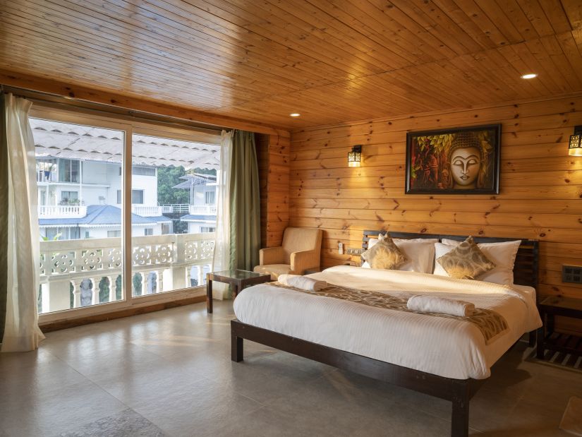 The wooden interiors of the Premium Cottage - Stone Wood Riverfront Resort, Siolim