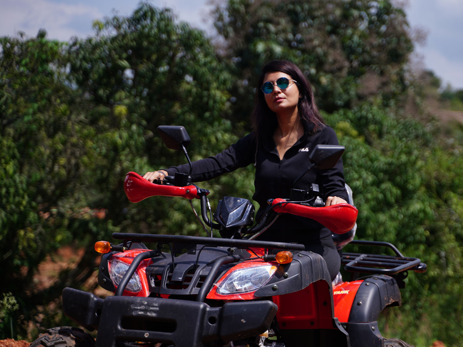 Ravishing Retreat Ramanagara - A guest riding the atv bike at our resort