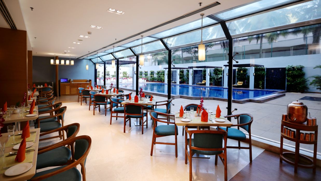 seating area overlooking the pool at Cascades restaurant in Vizag