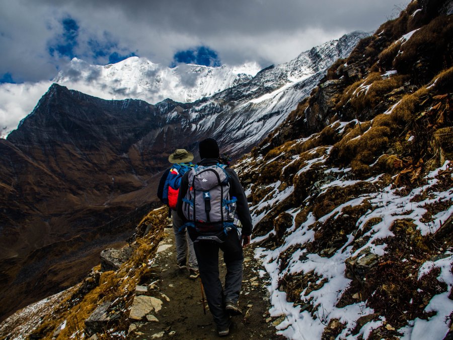 people trekking in the mountain valleys