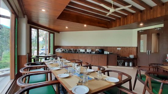 Side-view of the seating area at Verandah restaurant - Mastiff Xanadu, Manali
