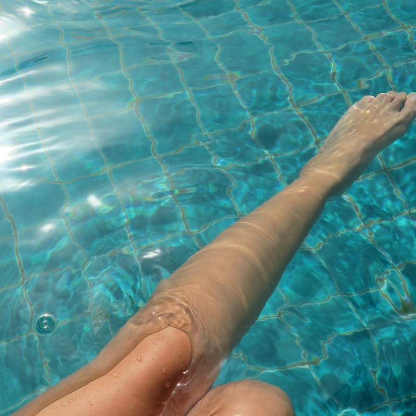 person lounging in the pool at OTP 