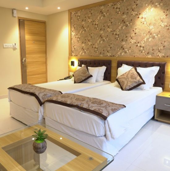 a view of premium room displaying double bed - Click Hotel Capital House, Patna