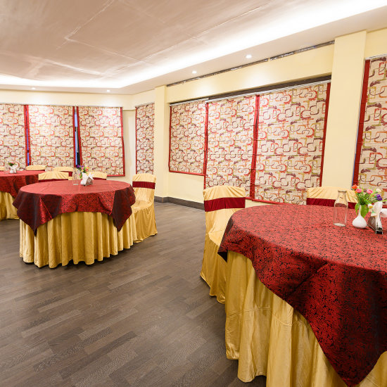 alt-text Conference room with round table seating arrangements at Silver Sand Sentinel, Port Blair