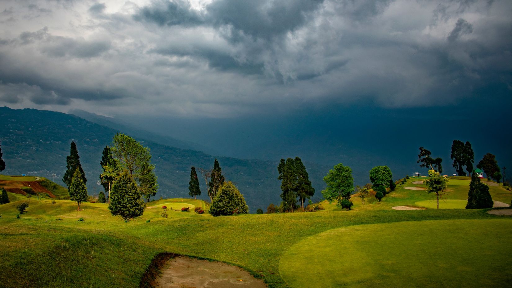 lush green deolo hills under an overcast sky