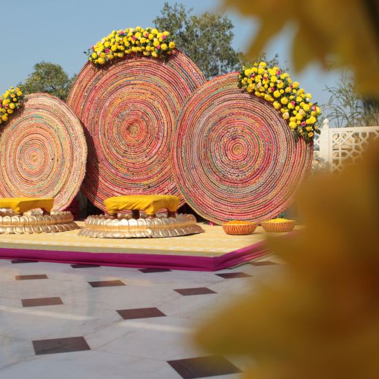 alt-text a stage set up on the terrace for the bride and groom with good decorations - heritage village resorts & spa, Manesar