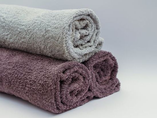 Image of three neately rolled towels