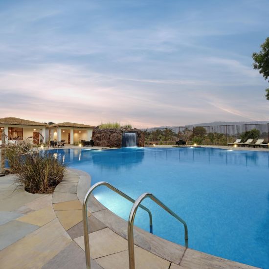 view of the swimming pool at The Baagh Ananta Elite resort in Ranthambore