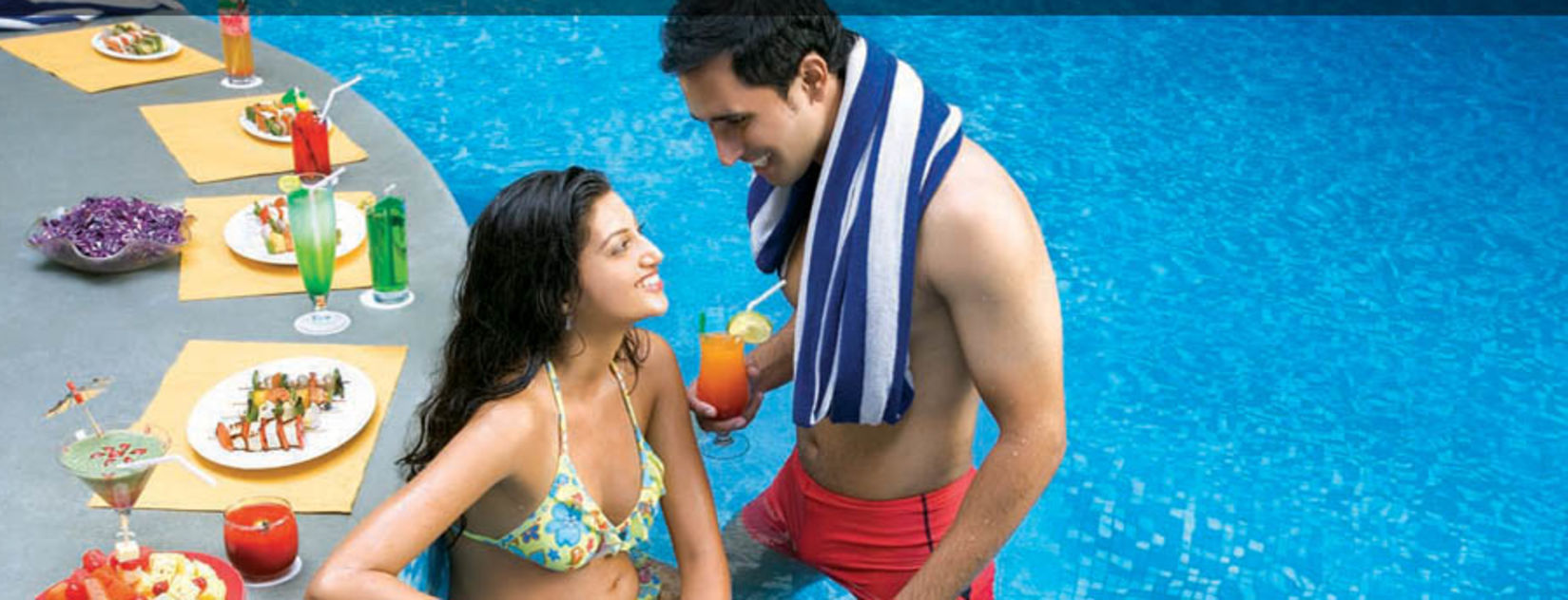 guests enjoying a poolside meal at Sunken Bar at The Retreat Hotel and Convention Centre Madh Island Mumbai