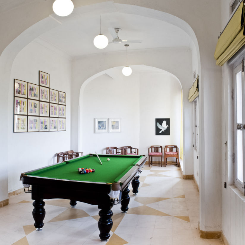 Hill Fort Kesroli 14th Century Alwar - image of a pool table in a room with white walls and white lights