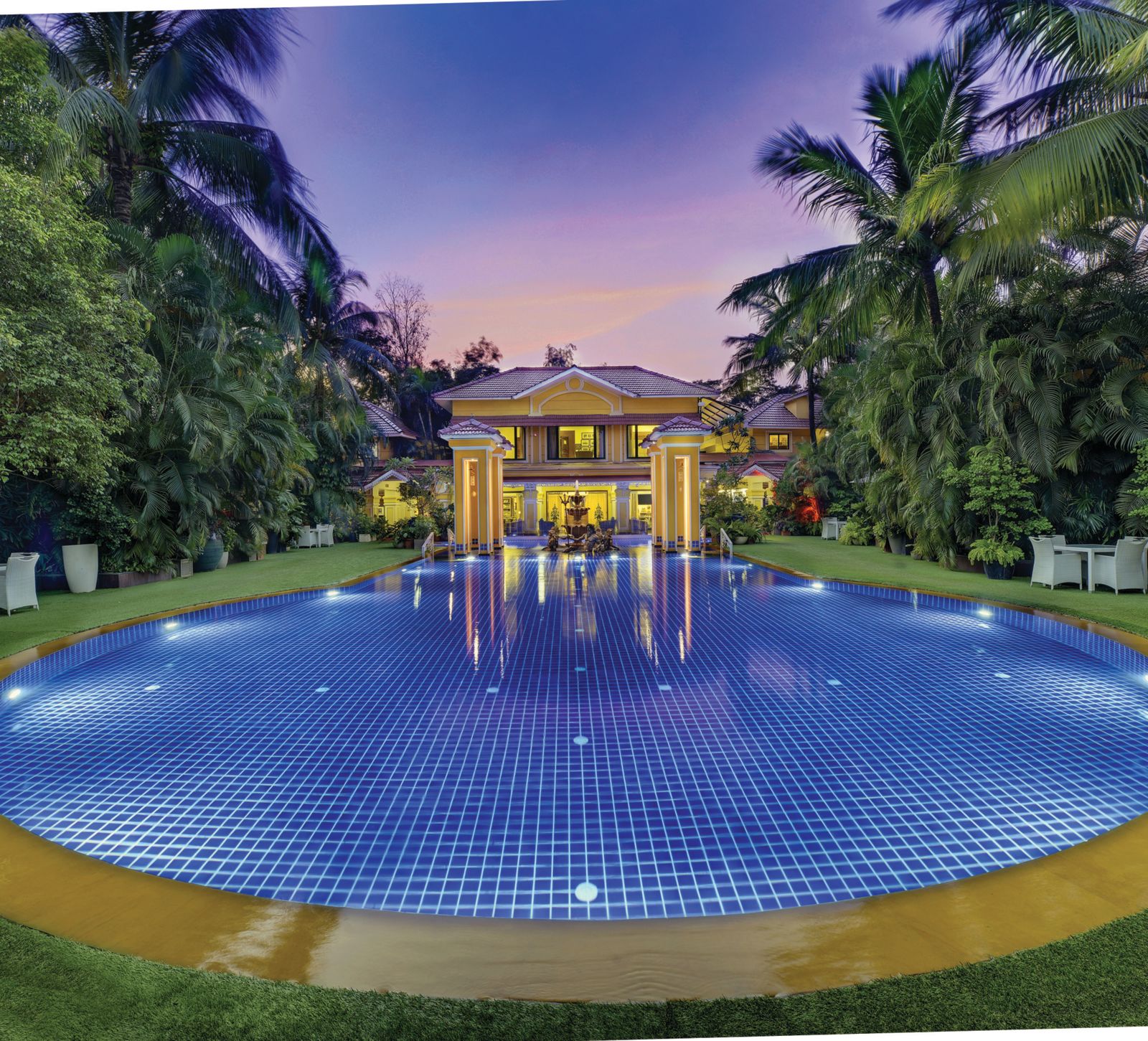 view of the swimming pool and the property behind it - Mayfair Lagoon, Bhubaneswar