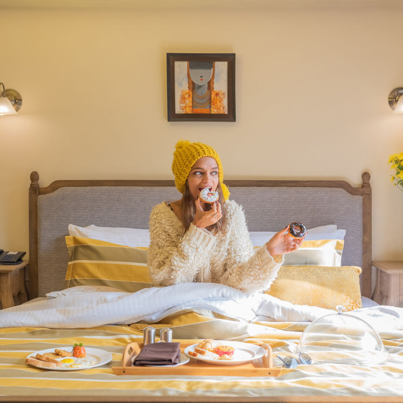 guest enjoying breakfast in bed