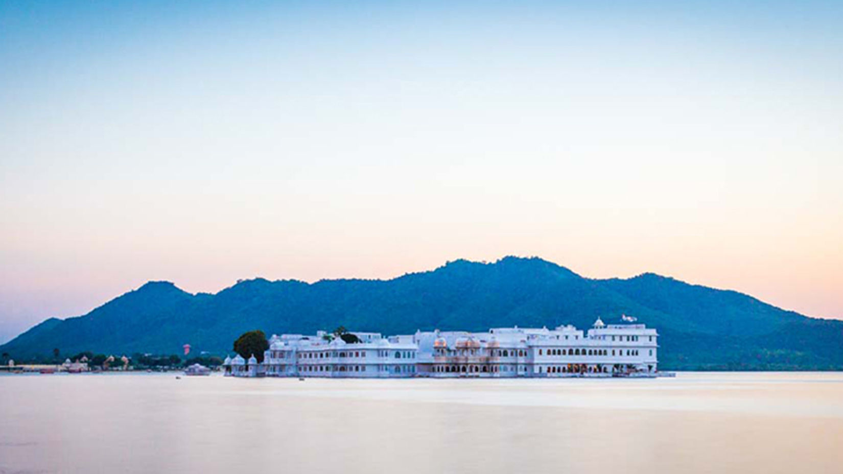 an overview of Lake Palace with a mountain in the background