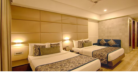 Premium Family room corner view with two large beds with side lamps and side drawers - Yashshree Milestone, Siliguri