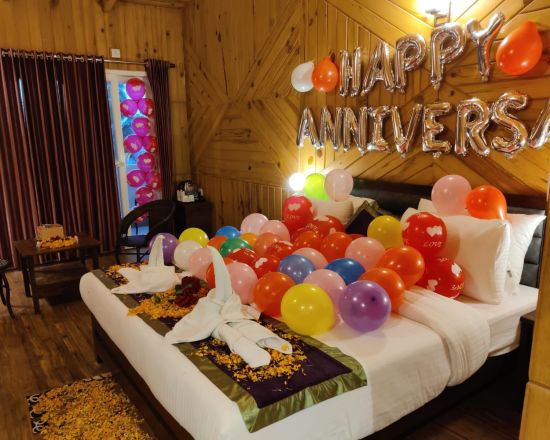 alt-text A well decorated room for anniversary celebration at  The Nature's Green Resort, Bhimtal