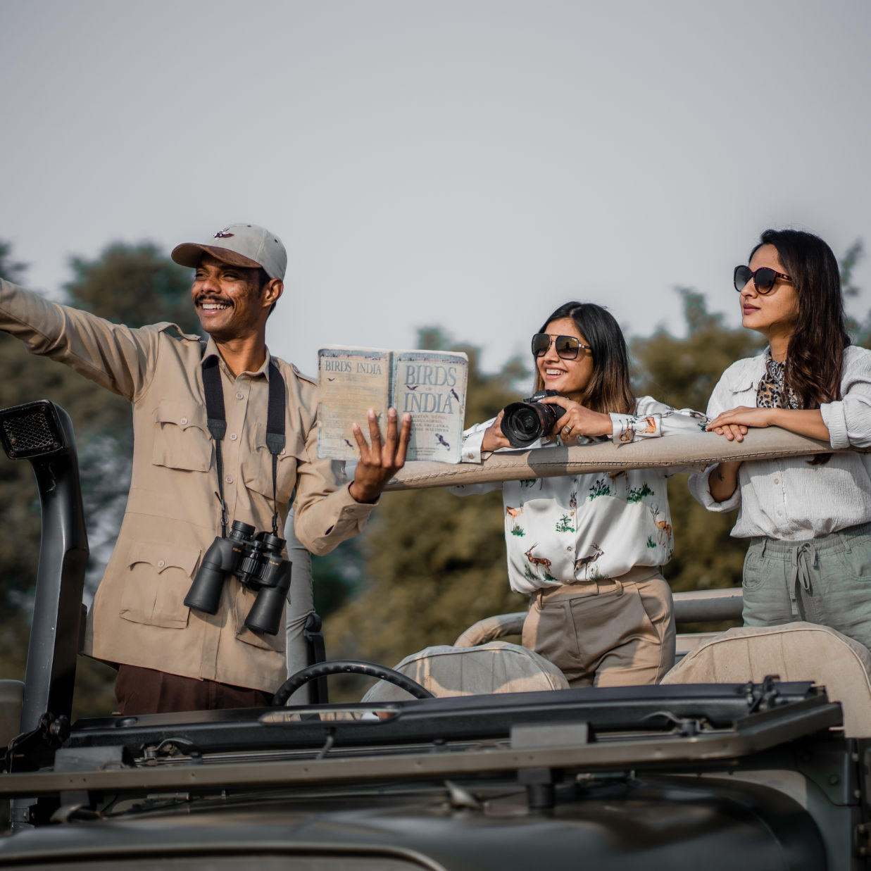 The Blackbuck Lodge - safari near our lodge with two women and a safari guide looking at a direction