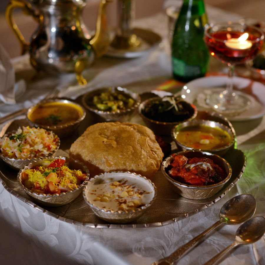 alt-text a plate served with indian breads and curry