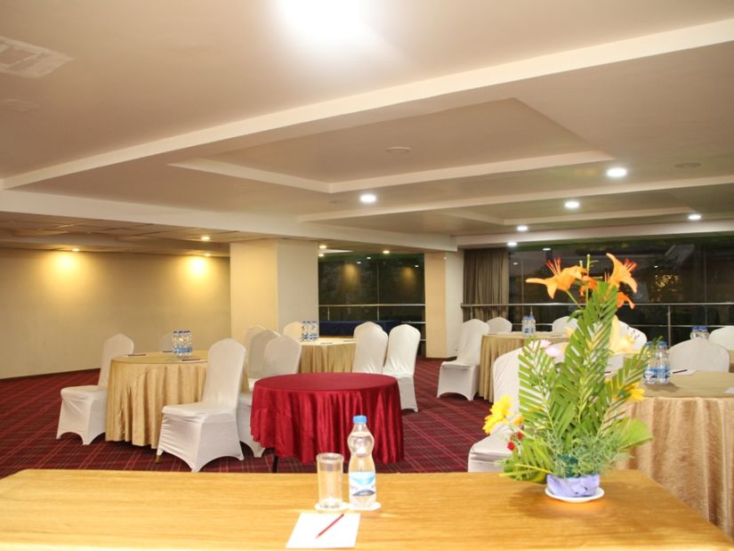 the indoor seating space in the banquet hall - Monarch Luxur Hotel, Bangalore 1