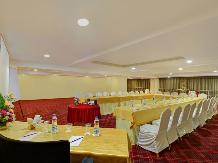 the indoor seating space in the banquet hall - Monarch Luxur Hotel, Bangalore 0