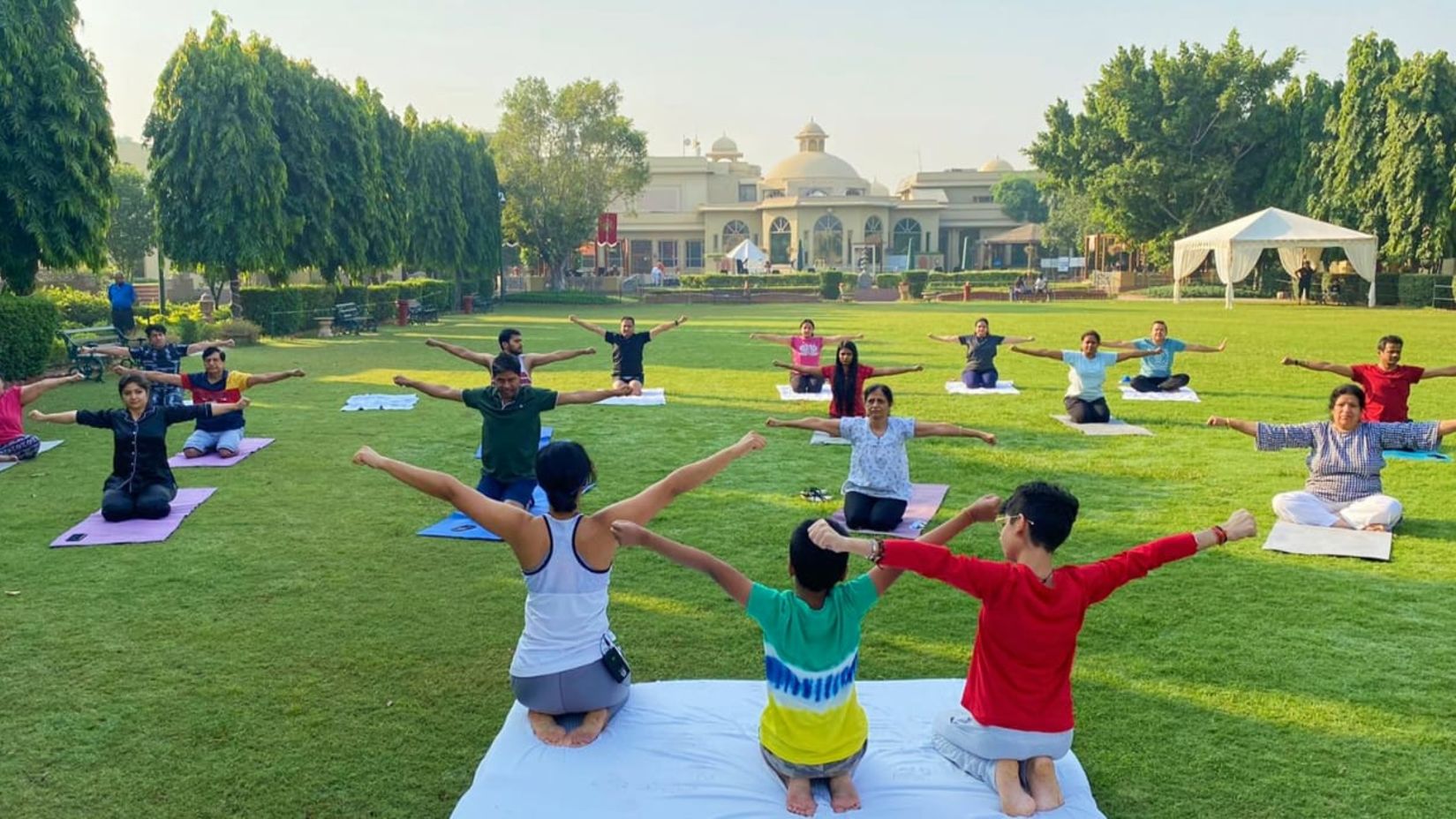 a yoga session on the lawns at Heritage village manesar 2