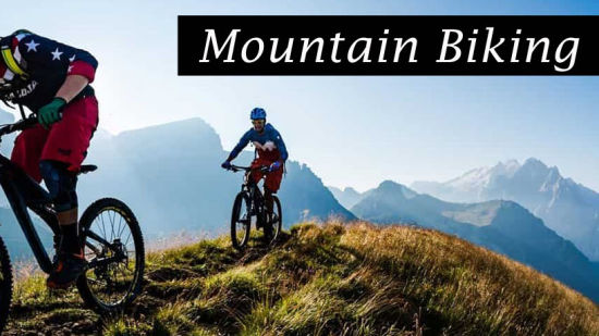 Two bikers biking on a mountain