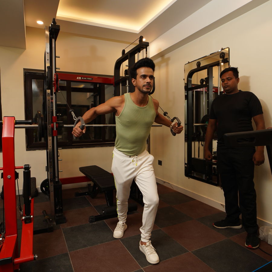 a person training with a trainer in the fitness centre - Shanti Seaview Resort & Spa