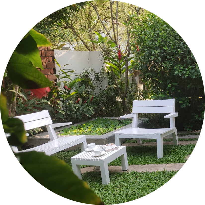 White garden chairs and table outdoors-Amanvana Spa Resort, Coorg - Luxury Resort