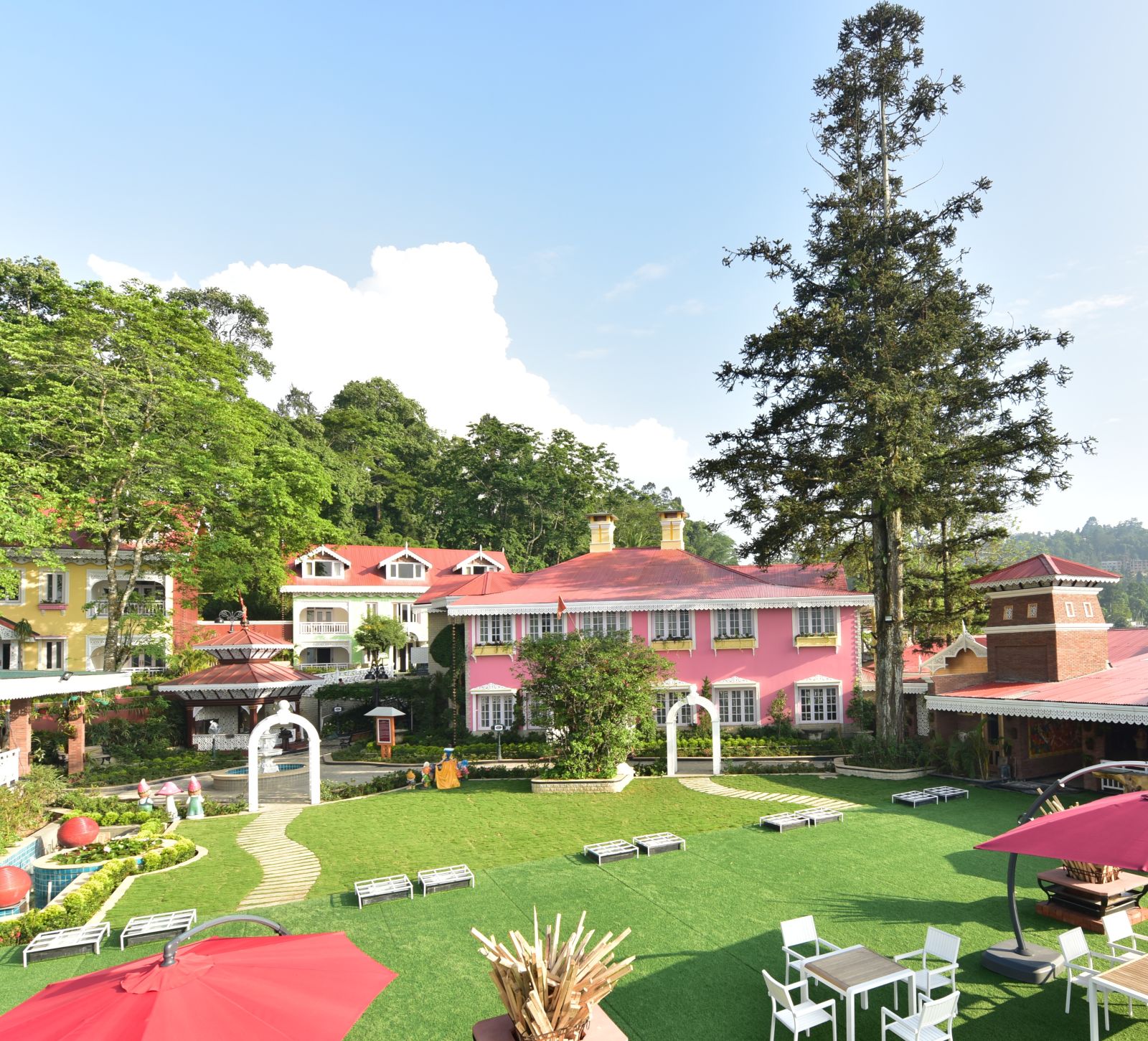 a panoramic view of the seating arrangement at the lawn - Mayfair Himalayan Spa Resort Kalimpong 1