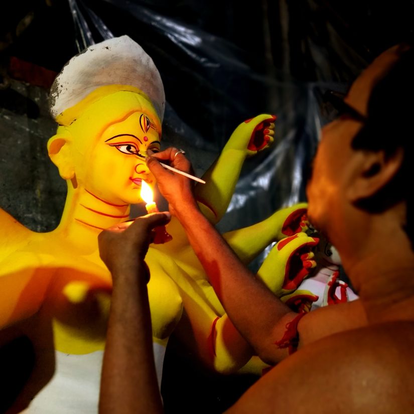 a craftsman making the model of Goddess Durga
