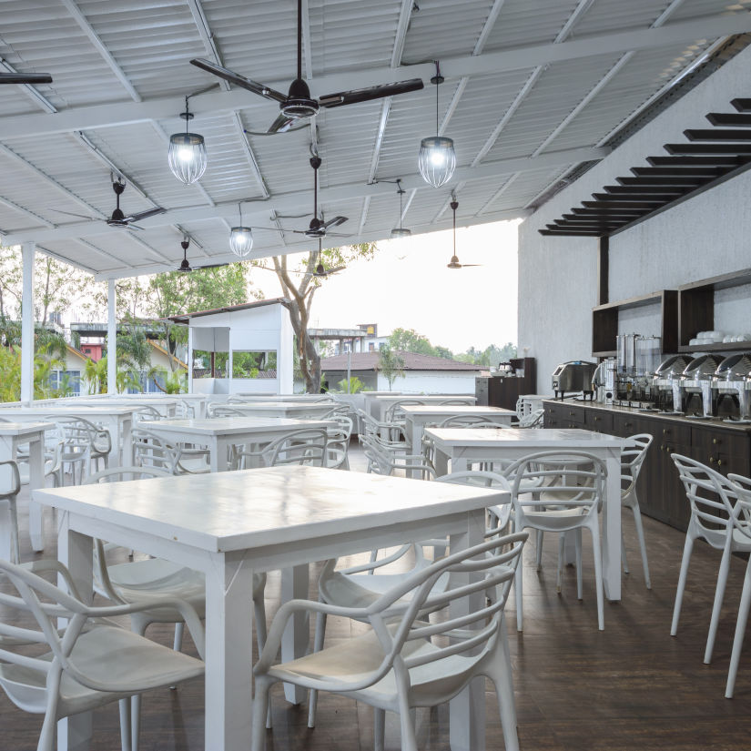 The table-chair arrangement at the white wood resort and spa restaurant