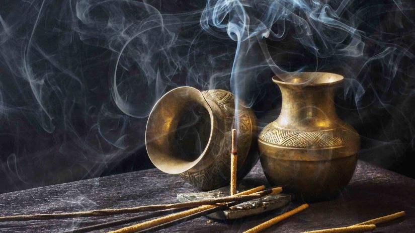 incense sticks burning at a temple