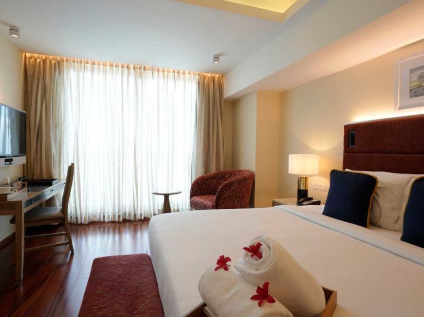 O By Tamara, Trivandrum - the plush king size bed offered by one of the rooms in Trivandrum