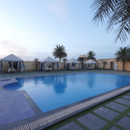 Side view of the The Palm Pool and tent seating at The Garden Ananta Elite Rajkot 2