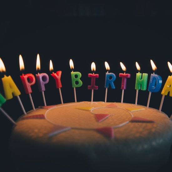 a cake with birthday candles lit