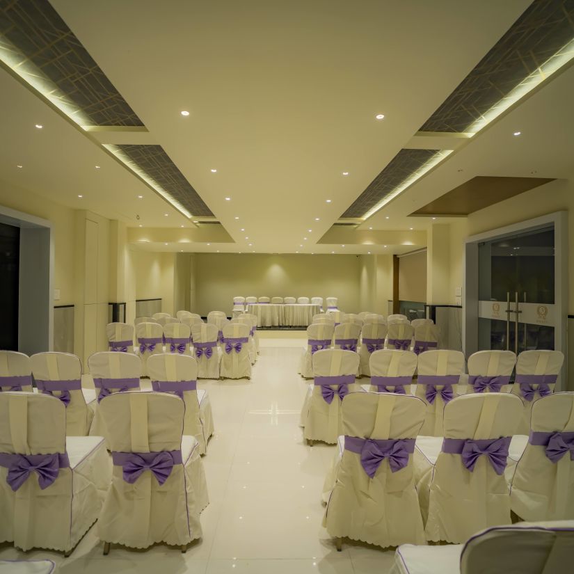 A back view of classroom seating of empty chairs at the best banquet hall in Karnataka