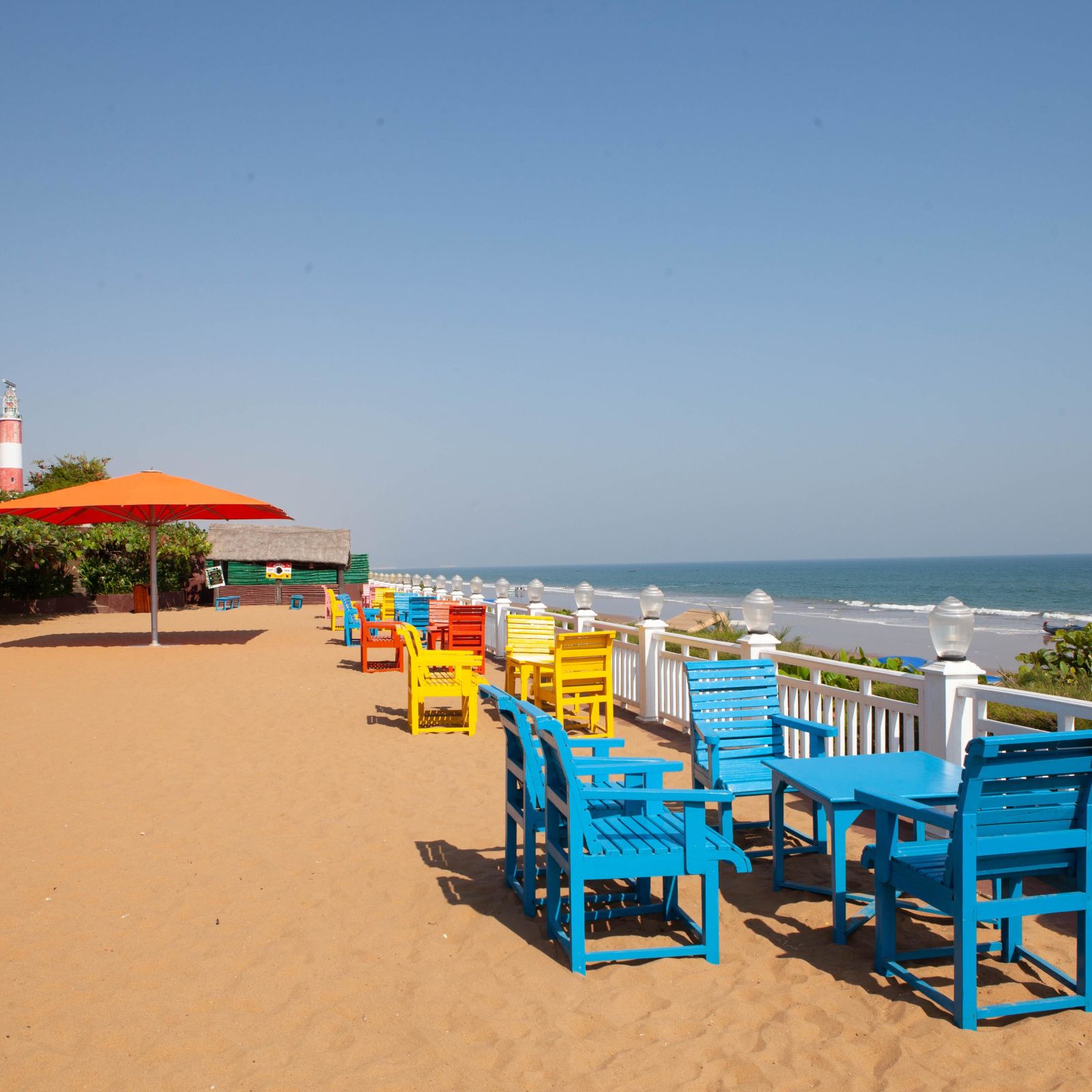 colourful benches facing the beach - Mayfair Palm Beach Resort, Gopalpur-on-Sea  1