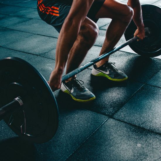 A person trying to do weight-lifting