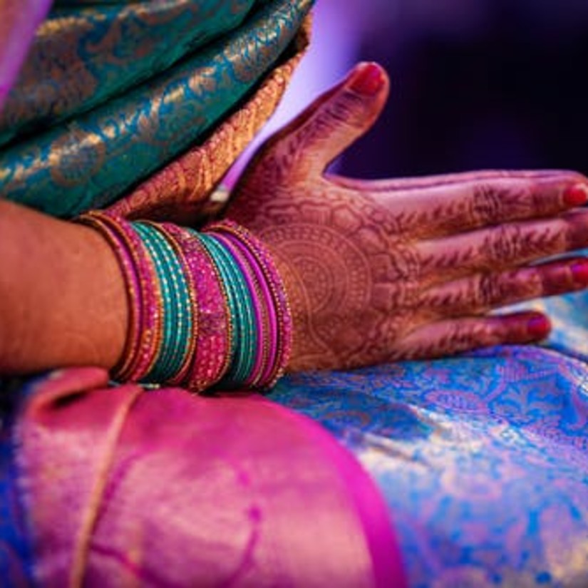 Woman holding her hands and praying - Hablis Hotel, Chennai