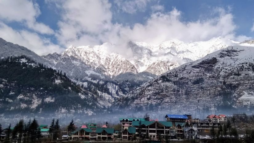 Bright sunshine shining on snow-covered mountains