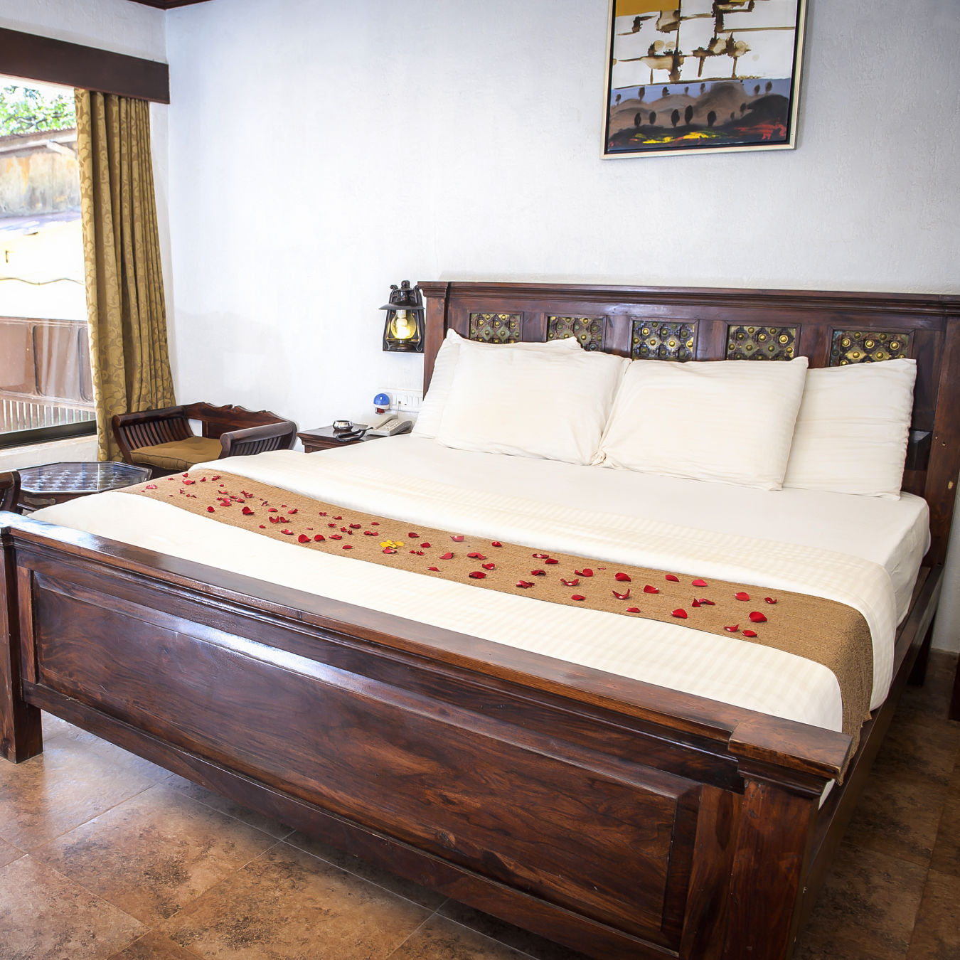 Adamo The Village - the balcony beside the king size bed offered at the Super Deluxe rooms in Matheran