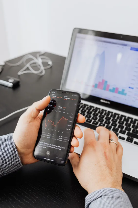 person with the laptop and mobilephone