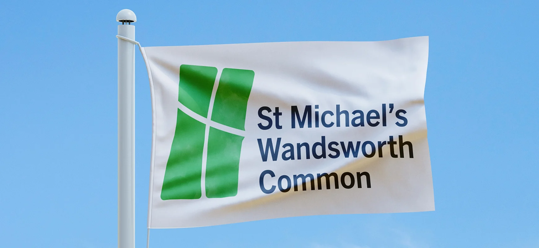 A branded flag with the new St Michael's Wandsworth Common logo.