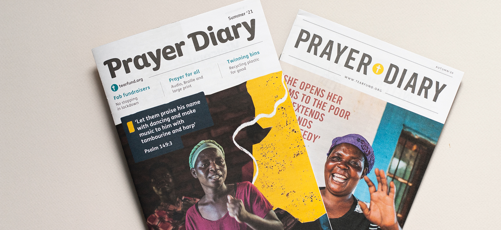 Two front covers of the Tearfund Prayer Diary one in their old brand and one in their new brand.