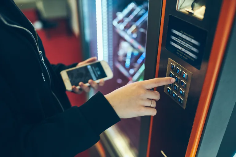 person ordering at vending machine